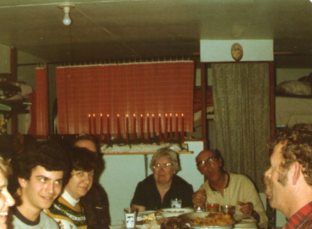 Pier Lake Cottage Family Gathered Around Table